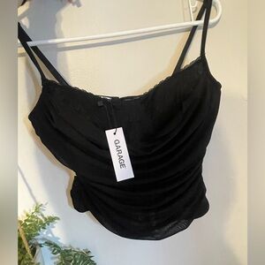 Black peekaboo buster top size medium Retail $59.95